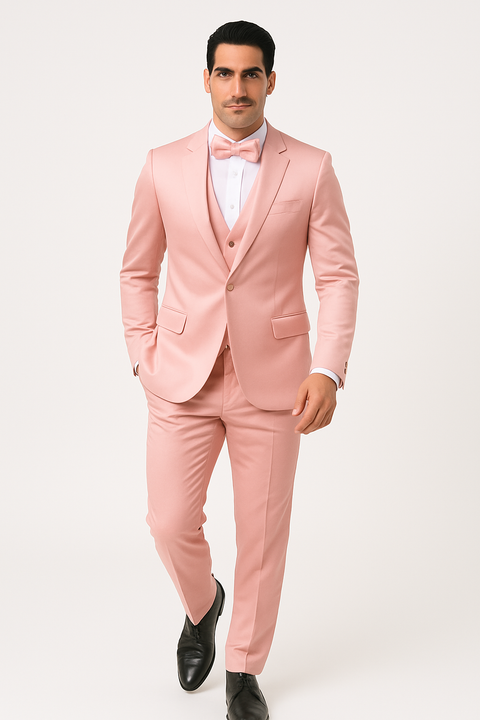 Alberto Nardoni's pink tuxedo set: slim-fit, lightweight fabric. Includes a pink jacket, trousers, and vest.  Complemented by a white shirt and pink bow tie. Formal, solid pink aesthetic.
