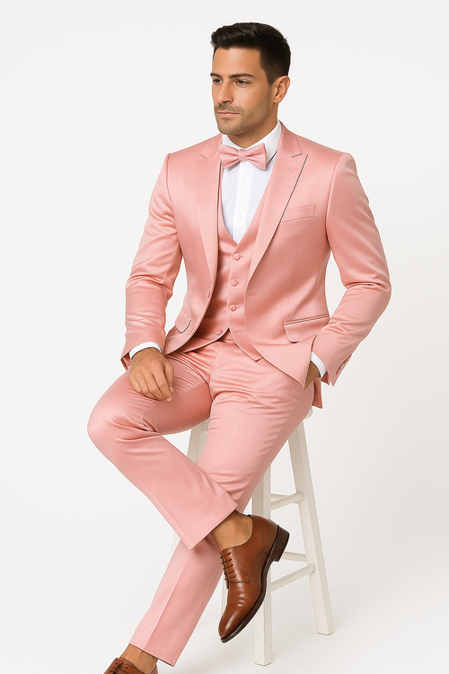 Alberto Nardoni's pink tuxedo set: fitted jacket (single-button, notch lapels), tapered trousers, six-button vest (darker pink), and matching bow tie. Smooth, shiny fabric.
