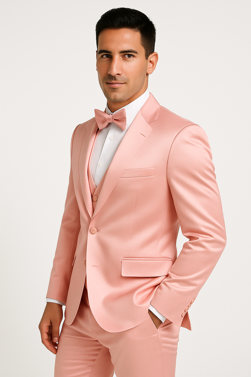 Alberto Nardoni's pink tuxedo set: four-piece formal wear with a fitted pink satin blazer (peak lapel, two buttons), matching vest, pants, and bow tie. Cohesive, elegant style.
