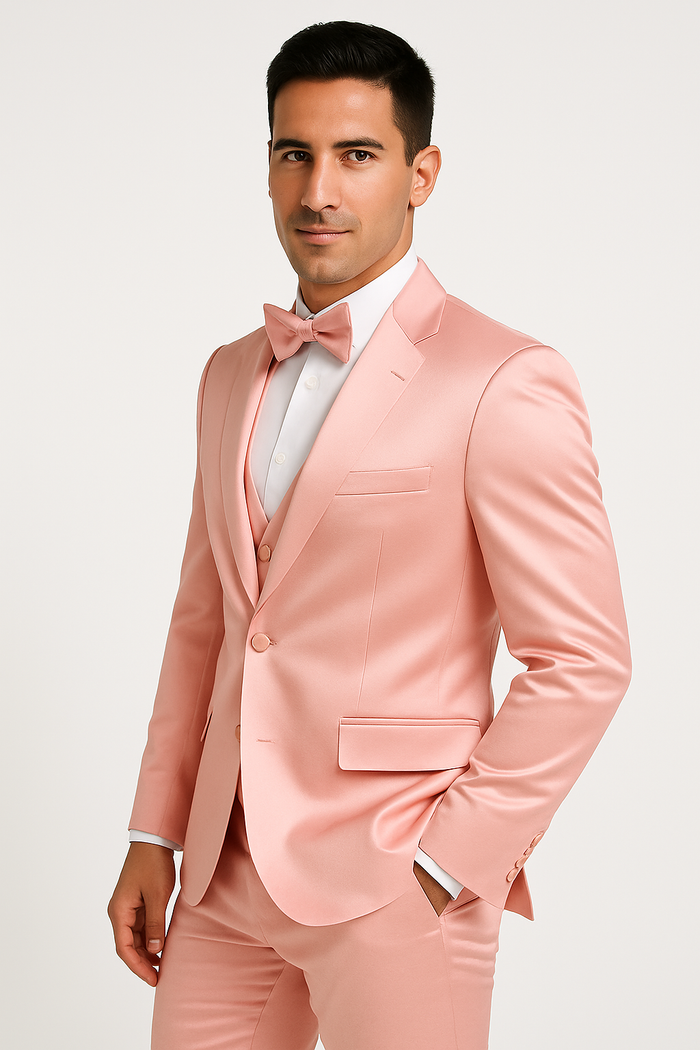 Alberto Nardoni's pink tuxedo set: four-piece formal wear with a fitted pink satin blazer (peak lapel, two buttons), matching vest, pants, and bow tie. Cohesive, elegant style.
