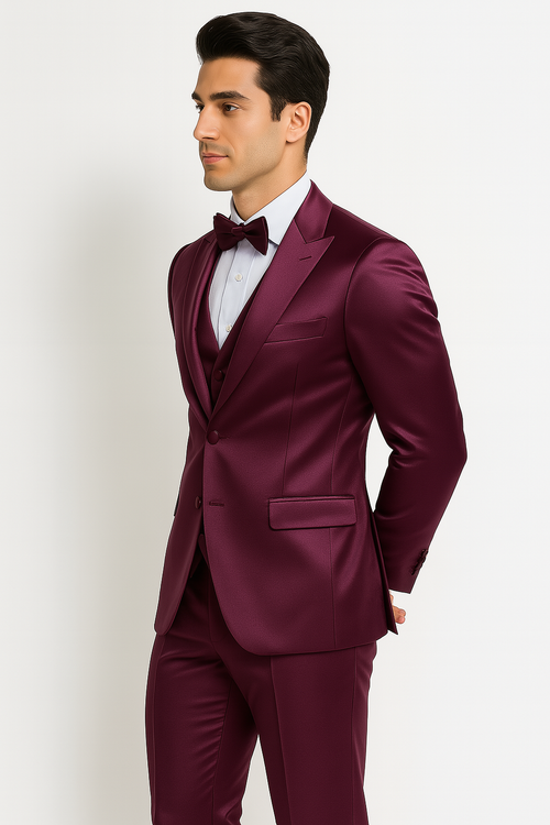 Purple Majesty Tuxedo: Slim-fit, deep purple set. Includes peak lapel blazer, 4-button vest, tailored pants, and bow tie. Smooth, satin-like fabric for a formal look. Modern, tapered fit.