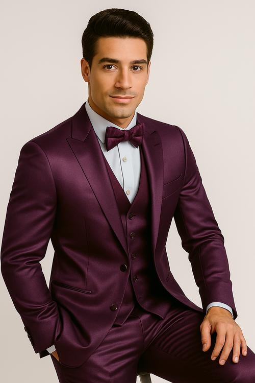 Purple Majesty 4-piece tuxedo: deep purple satin. Includes jacket (slim fit, structured shoulders), matching vest (5-button), tailored trousers, and bow tie. Light blue shirt visible.