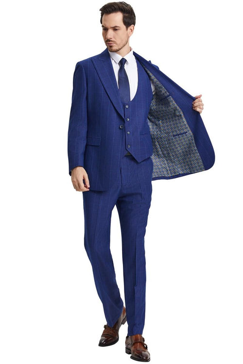 Men's Stacy Adams blue windowpane plaid suit. Peak lapel, scoop neck vest. Textured fabric, smooth finish, tailored fit. Jacket: two side pockets, contrasting lining. Fitted pants.
