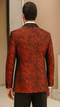 Red double-breasted jacket with rough streak pattern and satin peak lapel. Tailored fit, structured shoulders, textured fabric.
