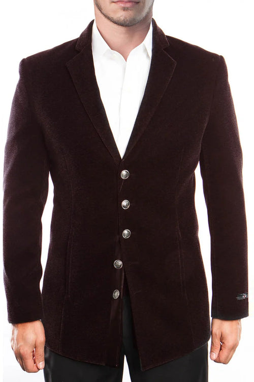 Men's vintage burgundy velvet coat. Five-button single-breasted, tailored silhouette with notched collar and metallic buttons. Plush texture, elongated hem, fitted shape tapering at waist, flared cuffs.
