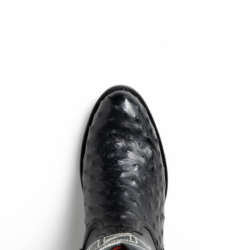 Black Marco Di Milano cowboy boots crafted from textured ostrich leather. Features a round toe, visible collar stitching, and a smooth finish for a stylish look.
