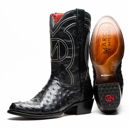 Marco Di Milano Savannah black ostrich quill cowboy boots. Tall shaft, rounded toe. Black ostrich leather with white stitching & decorative shaft pattern. Red interior. Polished soles, logo, rubberized tread.
