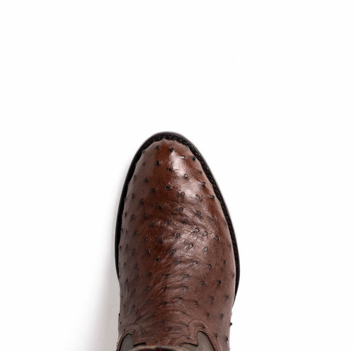 Marco Di Milano Kango Tabae cowboy boots. Dark brown ostrich leather upper with a textured, bumpy pattern. Round toe, outlined with thin black trim.

