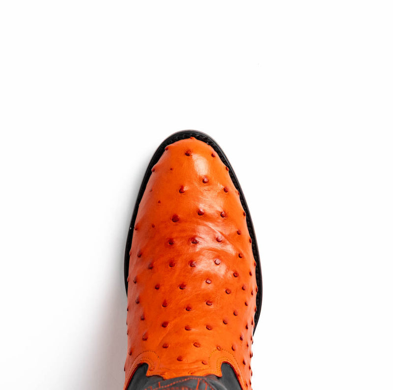 Marco Di Milano orange ostrich cowboy boots. Rounded toe, textured upper with raised quills. Crafted from orange ostrich leather for a distinctive look.
