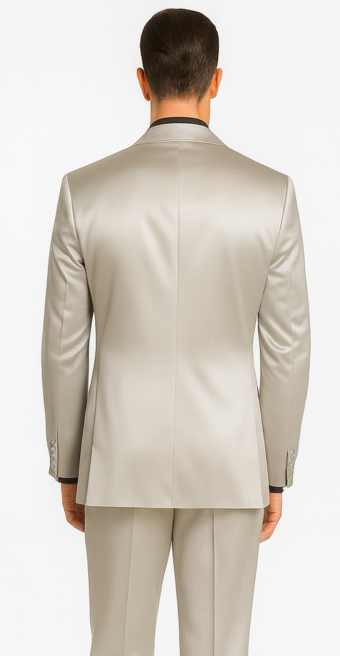 Stylish silver satin three-piece skinny fit suit. Peak lapel, fitted silhouette. Single vent, long sleeves. Reflective satin fabric. Matching slim-fit trousers.
