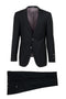Black Tiglio Italian suit: Tailored jacket with peak lapels, two-button closure, and single breast pocket. Features light purple lining. Flat-front trousers with side pockets. Sleek silhouette.
