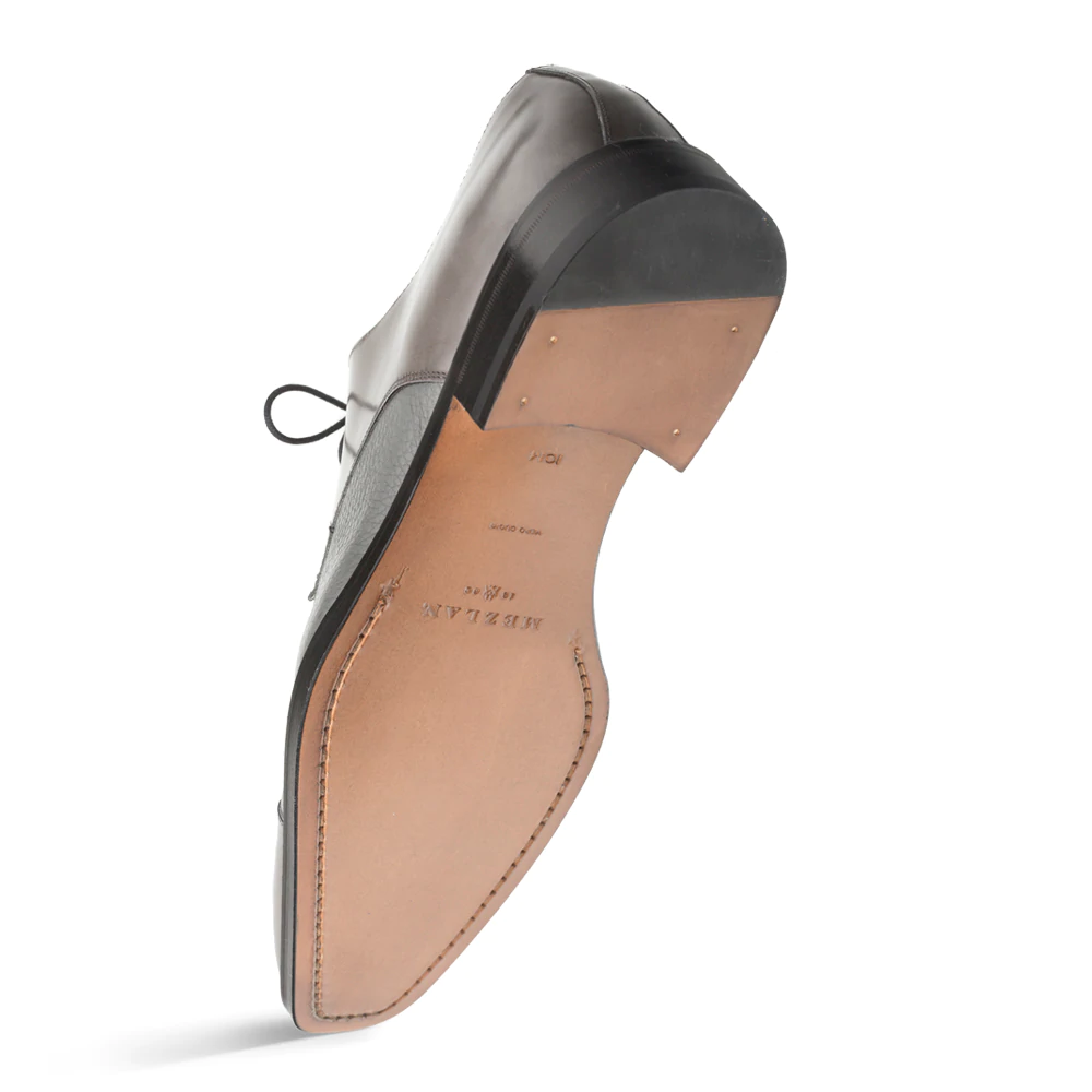 Mezlan Soka cap-toe shoes in gray calfskin deerskin. Polished finish, lace-up closure. Leather sole with stacked heel and smooth outer, classic shape.
