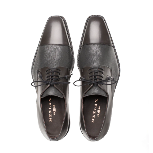 Mezlan Soka gray cap-toe shoes. Calfskin & deerskin upper, rounded toe with a slight square. Black laces, flat sole. Glossy toe cap contrasting textured body.
