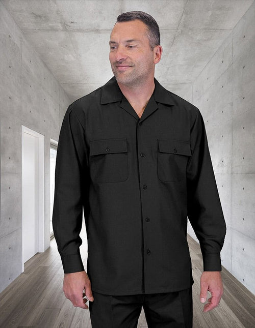 Men's black wool walking suit. Includes button-up shirt with collar & pockets, and pleated wide-leg pants. Made of 100% wool for a smooth texture & structured fit.