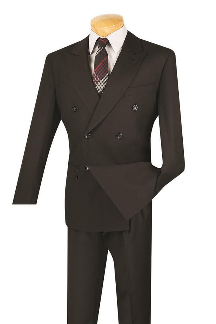 Black double-breasted suit with a modern fit. Tailored jacket, peaked lapels, dual pockets. Straight-leg trousers. Includes white shirt and patterned tie.
