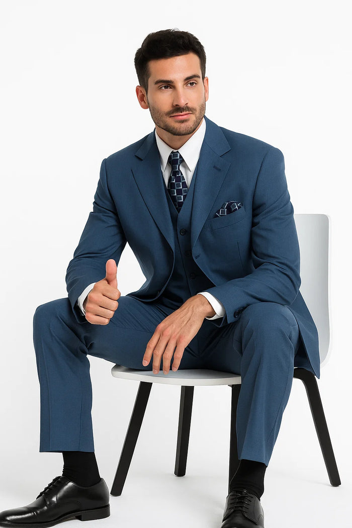 Sapphire steel blue men's three-button suit with structured blazer, notch lapels, and fitted silhouette. Features straight-cut trousers, smooth weave fabric. Includes white shirt, patterned tie, and pocket square.
