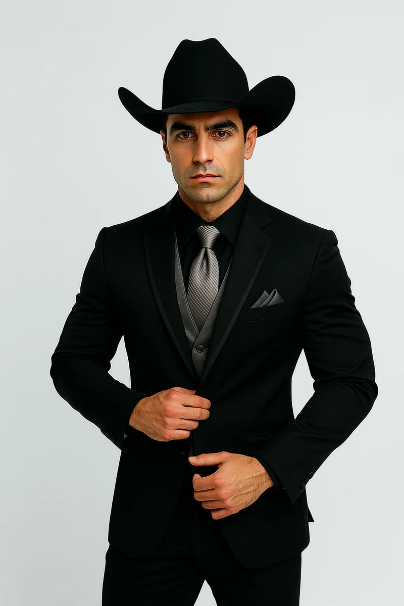 Men's black western tuxedo: fitted silhouette, smooth fabric. Silver vest & tie. Cowboy hat included. Classic western formal wear.
