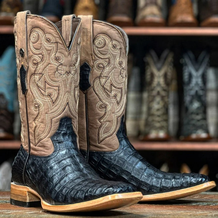 Dan Post Alamosa boots: Black full quill ostrich foot, tan leather upper with stitching. Square toe, stacked heel. Side pull tabs. Stylish and durable.
