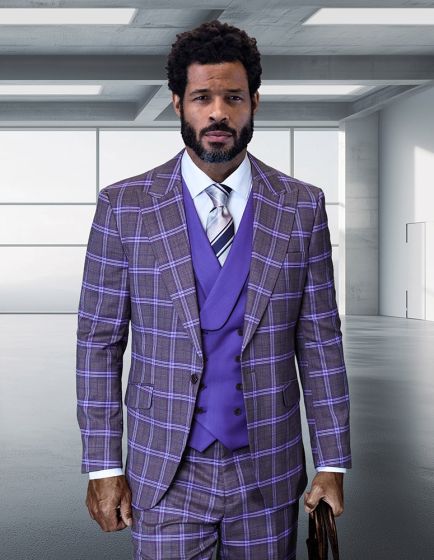 The Statement mens 3 piece plaid suit features a modern fit with a structured jacket and matching vest. The suit is composed of 100% wool, displaying a prominent plaid pattern in shades of purple and gray. The three pieces include a jacket, vest, and trousers, all designed with sharp lines and tailored components.