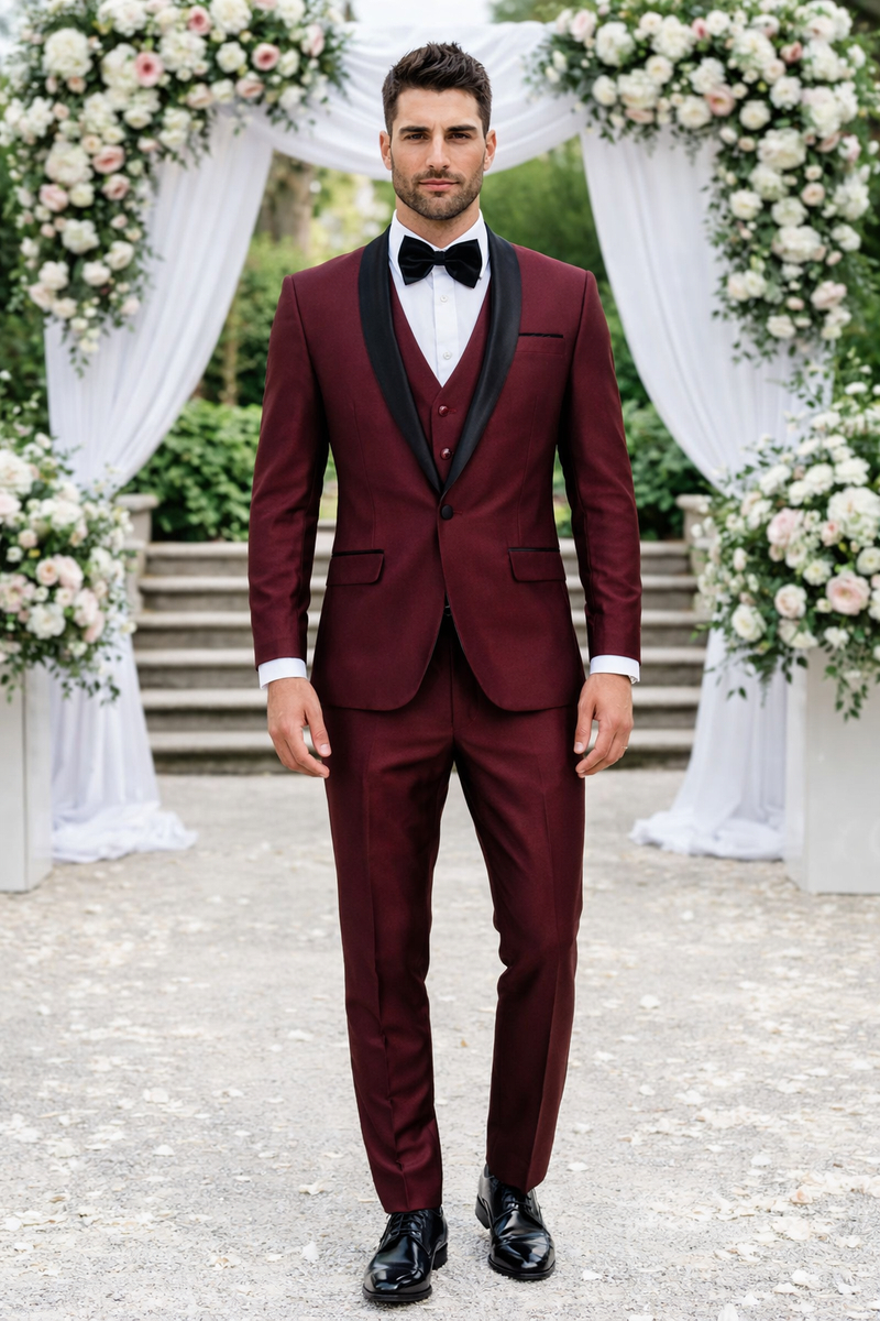 Burgundy 3-piece tuxedo with a fitted design, shawl lapel, and matching waistcoat. Black accents, smooth fabric, and a slim-fit trouser silhouette. Features buttonholes for a complete look. Includes a classic white shirt.