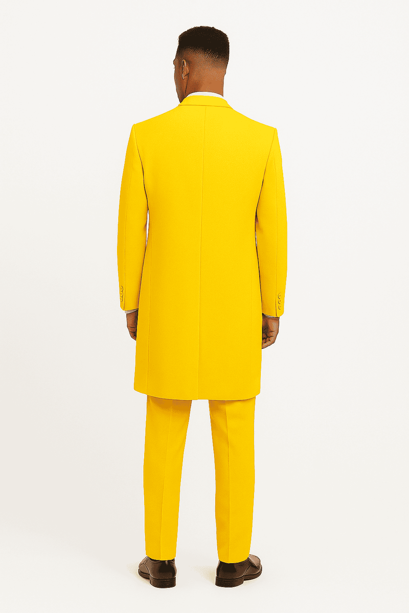 Bright yellow zoot suit: long, structured jacket with tapered pants. Solid yellow fabric, vintage 1920s style. Jacket features a single back vent & three cuff buttons. Bold color, tailored fit.