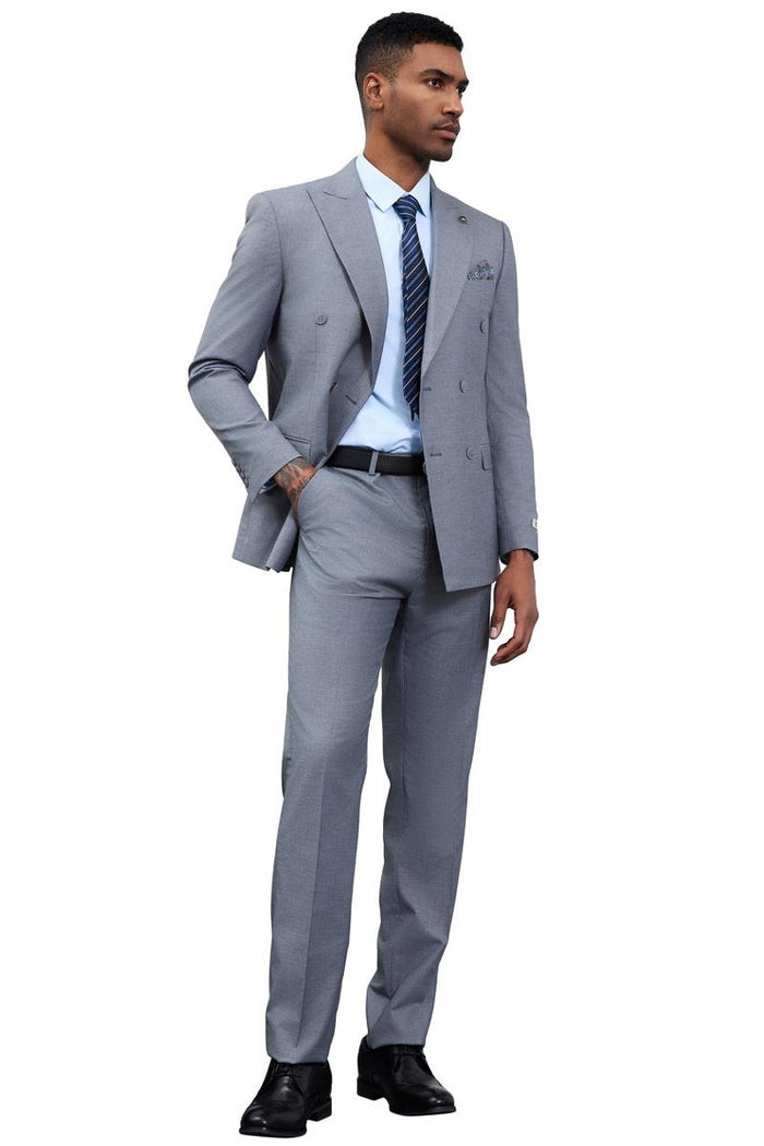 Stacy Adams grey double-breasted suit: tailored fit, structured shoulders, slim silhouette. Lightweight fabric, peak lapels, flat-front trousers. Light grey color, paired with light blue shirt and striped tie.
